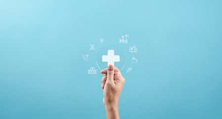 Health insurance and medical welfare concept. people hands holding plus symbol and healthcare medical icon, health and access healthcare.の写真素材
