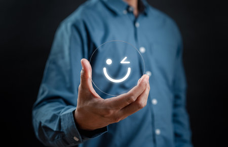 Hand holding Happy smile face, mental health positive thinking and growth mindset, mental health care recovery to happiness emotion.の写真素材