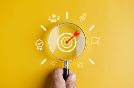 Magnifier glass focus to target objective with idea creative light bulb icon. planning development leadership and customer target group concept.の写真素材