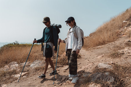Hiking Couple Activity climbing on mountain backpack travel and adventure, Travel lifestyle in nature.の写真素材