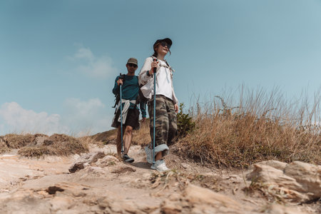 Hiking Couple Activity climbing on mountain backpack travel and adventure, Travel lifestyle in...