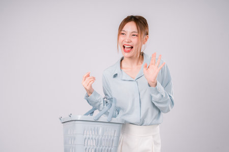 Woman Basket Supermarket Order Purchase Package Retail Choice Customer Enjoy, Happy Young Woman Holding a Basket, Enjoying Her Shopping Experience with Smart Choices and a Smileの写真素材