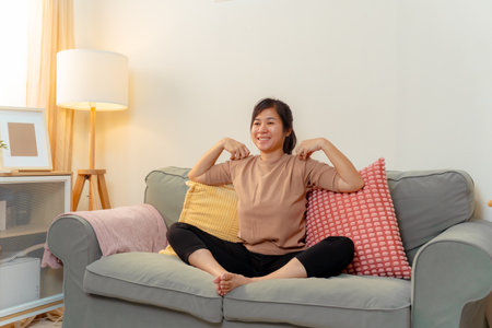 Woman Exercise Training Lifestyles Exercising Stretching People Yoga Healthy Lifestyle, Confident Female Practicing Relaxing Stretch Routine Indoors, Embracing Wellness and Flexibility at Homeの写真素材