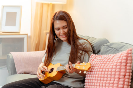 Woman Asian Playing Music Ukulele Lifestyle Relax Lesson Fun Relaxation, Cheerful Moment of Home...