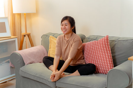Woman Exercise Training Lifestyles Exercising Stretching People Yoga Healthy Lifestyle, Confident Female Practicing Relaxing Stretch Routine Indoors, Embracing Wellness and Flexibility at Homeの写真素材