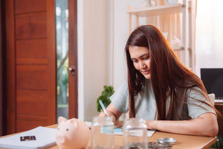 Woman Financial Working Planning Saving Accounting Businesswoman Report Female Office, Professional Analyzing Reports and Planning Financial Strategies for Business Success at Her Office Deskの写真素材