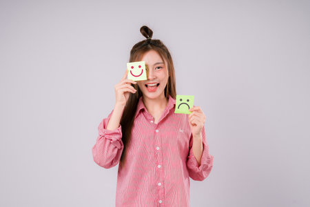 Smile happy face on hands of woman with massage between sad and normal emotion, Positive emotion,...
