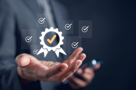 Guarantee and quality standard concept with checkmark icon in hand. Represents business trust, certification, approval system, and verified performance assurance.の写真素材