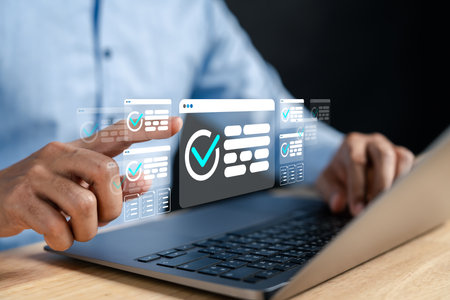 Businessman using technology to verify online documents with digital check marks. Concept of documentation, document management, database, and signing digital agreements and contracts.の写真素材