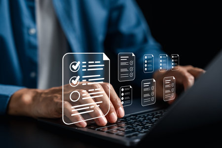 Digital document checklist and online survey form concept. User interacting with digital forms on a laptop, showing task approval and checklist workflow for productivity and data submission systems.の写真素材
