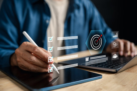 Target planning and goal setting for business success, digital checklist and dartboard on tablet screen. Ideal for strategy, achievement, task tracking, and productivity workflowの写真素材