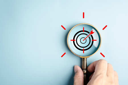 Target objective focus on magnifying glass with light bulb creativity precision goal setting,...