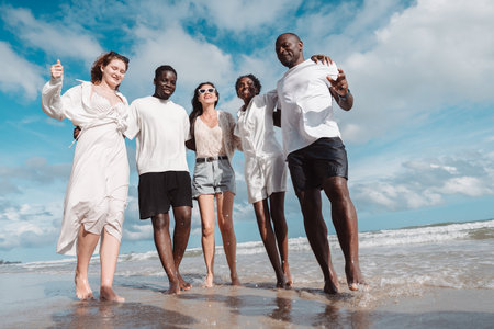 Happy diverse group of friends together on the beach, Active friendship, summer fun, positivity, and...