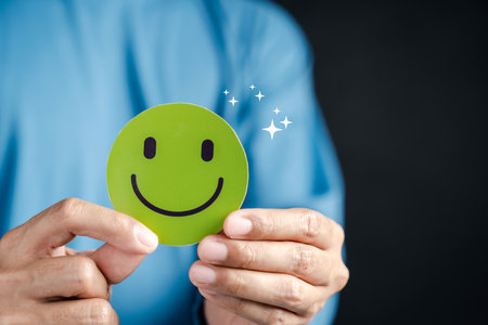 Customer satisfaction with green smiley face. positive review, happiness, service quality, feedback, trust, and successful business relationship.の写真素材