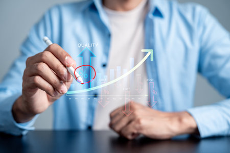 Business concept of selective quality improvement and cost reduction strategy. Hand pointing at percentage sign on financial growth chart, profit, efficiency, and performance management.の写真素材