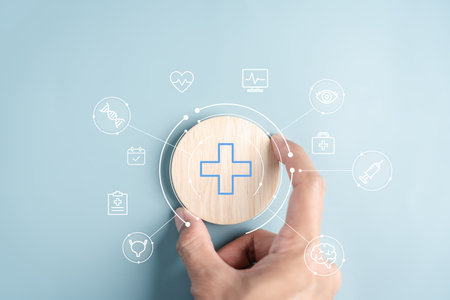 Health tech concept with hand holding wooden block medical cross and futuristic digital health, innovation in diagnosis, treatment, wellness, and remote care.の写真素材