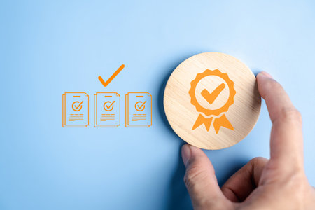 Quality assurance process with approval certificate and checklist documents, compliance verification, audit, regulation, standard certification, and corporate document management system.の写真素材