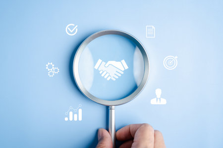 Magnifying glass focusing on handshake with business, procurement, supply chain management, contract negotiation, and strategic vendor partnership in corporate trade.の写真素材