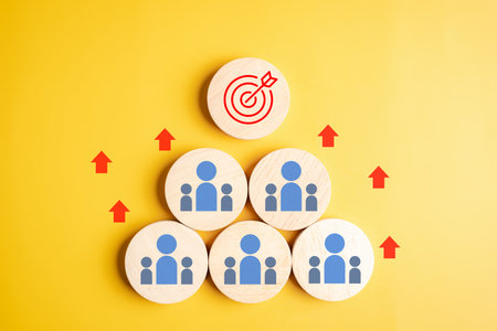 Teamwork to goal concept, people icons, and target symbol. leadership, collaboration, goal achievement, business success, and strategy for team development.の写真素材
