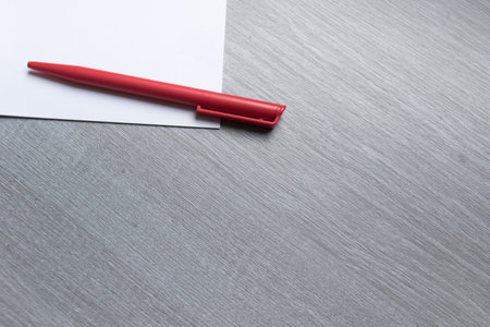 red pen on tableの写真素材