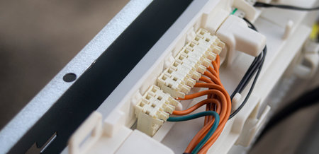 Close up of network cables connected to power supply cabinet. Selective focus.