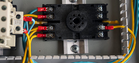 Electrical panel with circuit breakers and wires, close-up