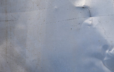 abstract background texture of old sheet of Aluminium with cracks and scratchesの写真素材