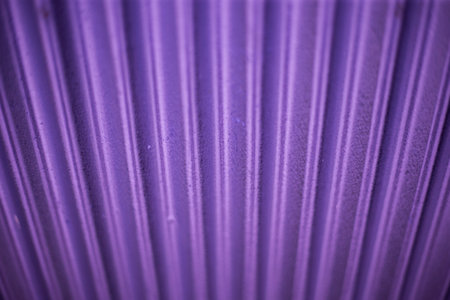 Close up detail of a purple corrugated metal sheet texture backgroundの写真素材
