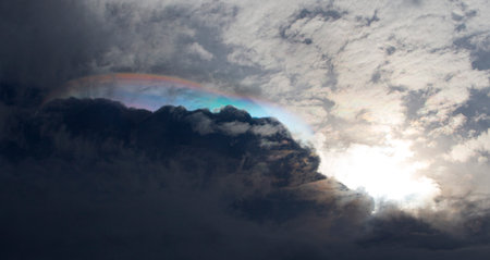 Cloudscape has been developing in gorgeous form. The clouds are multicolored with beautiful rainbow.の写真素材