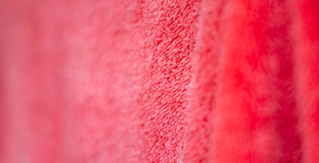 Red towel on the wall as an abstract background. Horizontal photo
