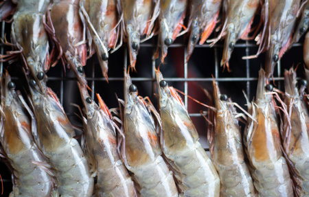 Close up of fresh tiger prawns for sale at a seafood market