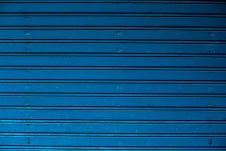 Blue corrugated metal texture useful as a background with copy spaceの写真素材
