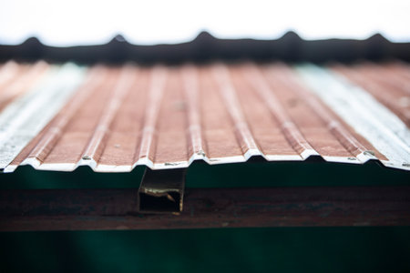 Old rusty roof tiles close-up. Selective focus with shallow depth of field.の写真素材