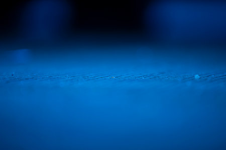 abstract blue background with bokeh defocused lights and shadowの写真素材