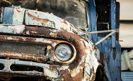 Detail of an old rusty car in a junkyard.の写真素材