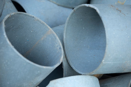 Pile of metal pipes, close-up. Abstract background.