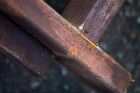 Rusty steel rod close-up. Industrial background. Selective focus.