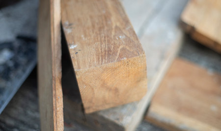 Wooden planks in a sawmill, closeup of photo