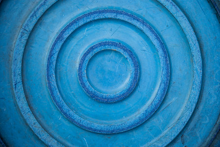 Close-up of a blue metal circle. Abstract background and texture.の写真素材