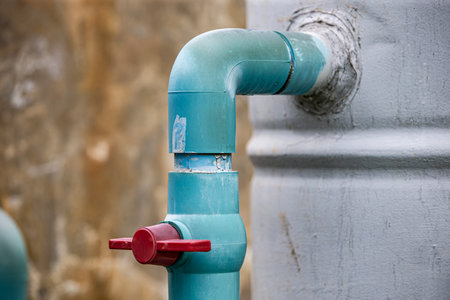 Close up of a water tap in a public water supply system.