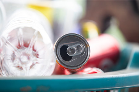 Close up of crumpled cans in basket. Selective focus.の写真素材