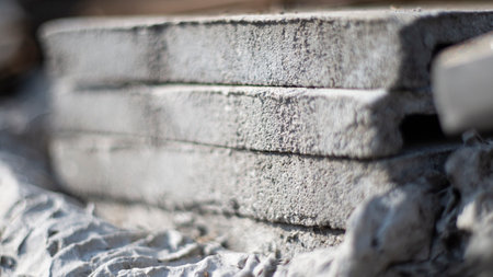 construction of a brick wall on the street, close-upの写真素材