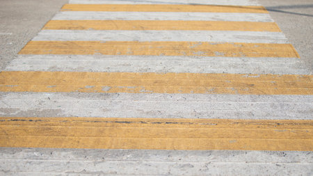 Zebra crossing on the road in the city, closeup of photoの写真素材