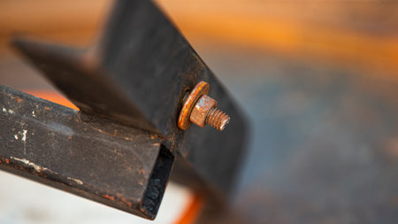 Old rusty bolt and nut on a piece of iron, close-upの写真素材