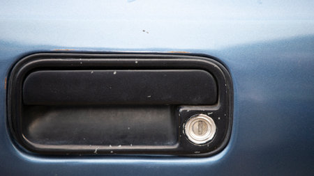 Detail of the door handle of a blue car. Car door.の写真素材