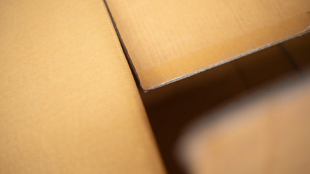 Close up of a cardboard box with shallow depth of field. Abstract background.