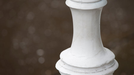 Close up of a white classical balustrade in the park.
