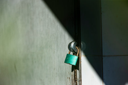 Padlock on the door of a building. Selective focus.