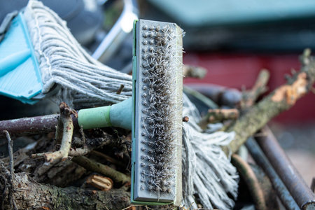 Close up of old dirty brush for cleaning and cleaning the garden.