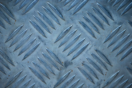 Close up of steel diamond plate texture for background. Selective focus.の写真素材